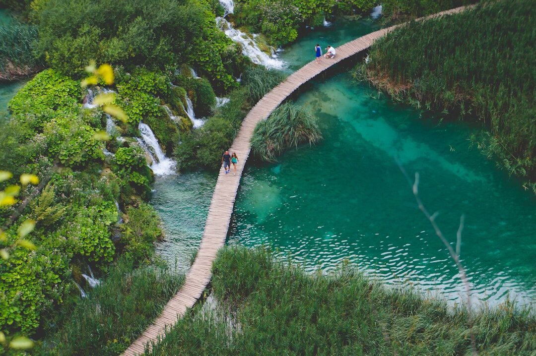 Turquoise waterfalls and wooden walkways at Plitvice Lakes