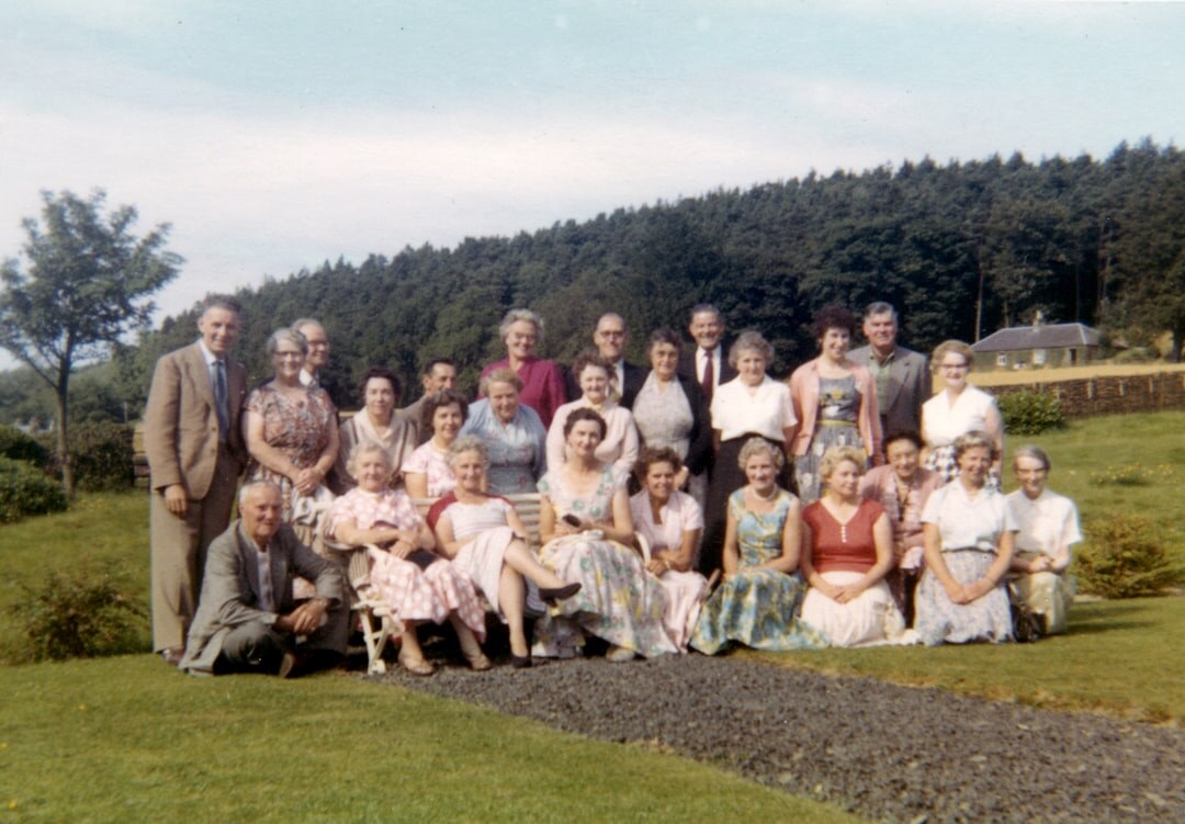 Large group photo of senior club members outdoors