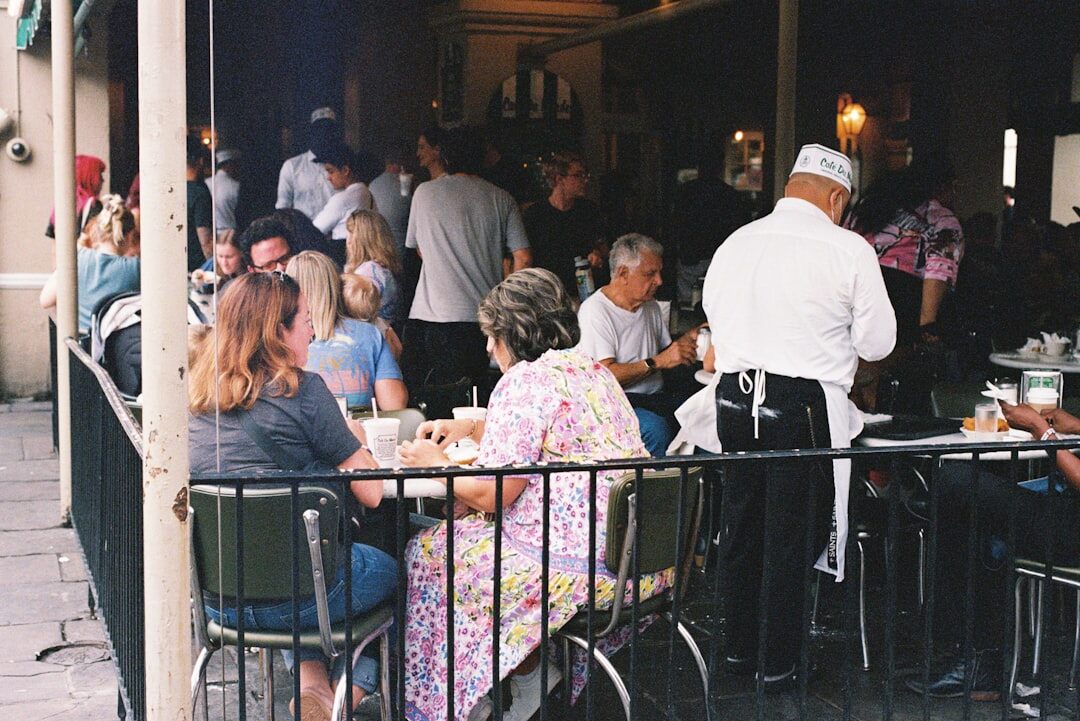 Seniors having lunch together on a restaurant terrace