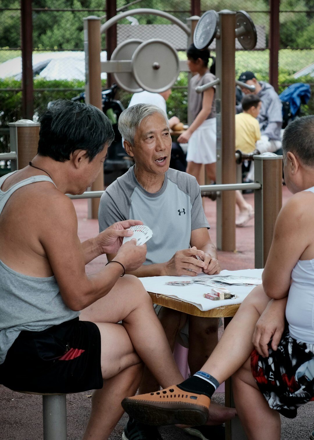 Activity leader guiding a group of seniors in an exercise class