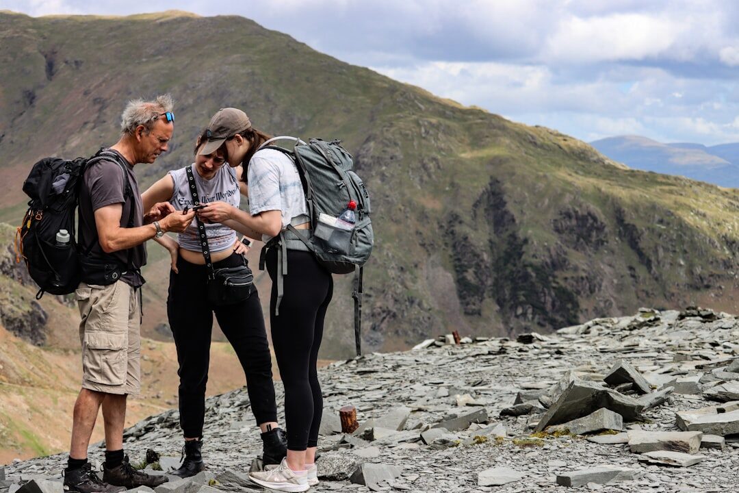 Travel agent showing a brochure to a senior couple