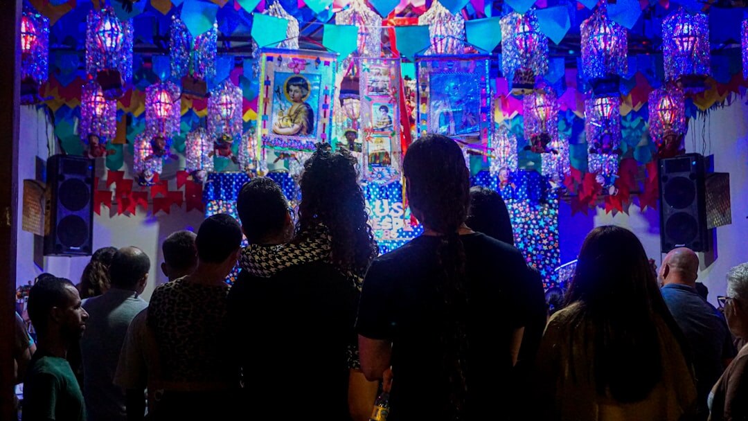 Seniors gathered at a cultural event in a decorated hall
